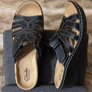 Clarks Black Leather Slides with Brown Footbed